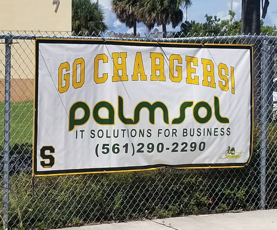 PalmSol Go Chargers sponsorship banner at Suncoast High School